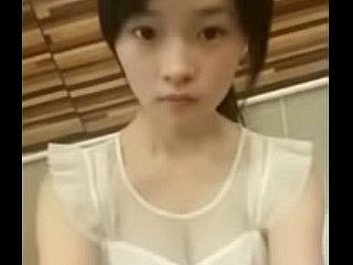 Cute chinese teen winking on high webcam